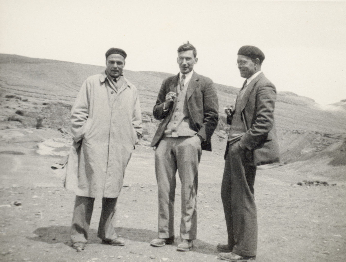 Black and white image of Joseph Upton, Walter Hauser, and Charles Wilkinson standing in a row in Nishapur