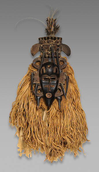Kpeliye’e headdress, Senufo artist, Wood, horns, quills, raffia fiber, cotton cloth, feathers, metal, applied organic materials, Senufo peoples