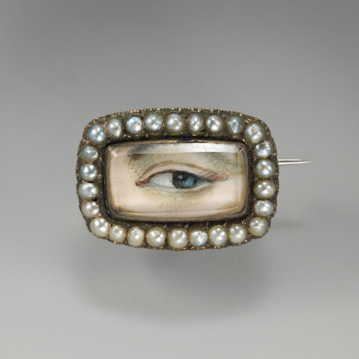 "Eye" brooch, Portrait miniature possibly on ivory; pearls; rock crystal; gold, English