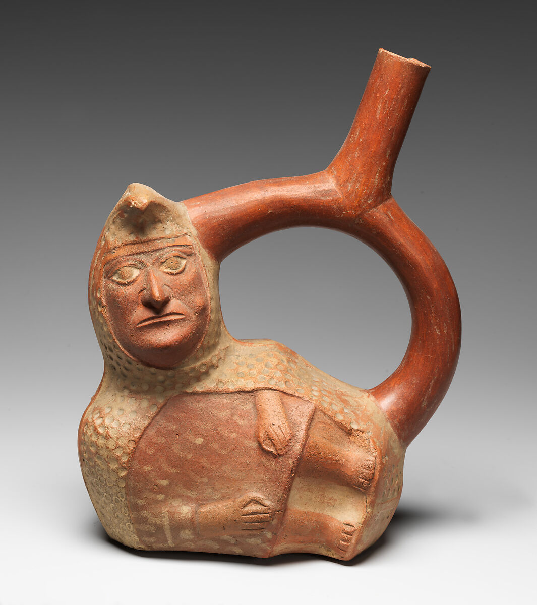 Stirrup-spout bottle with peanut figure, Moche artist(s), Ceramic, slip, Moche